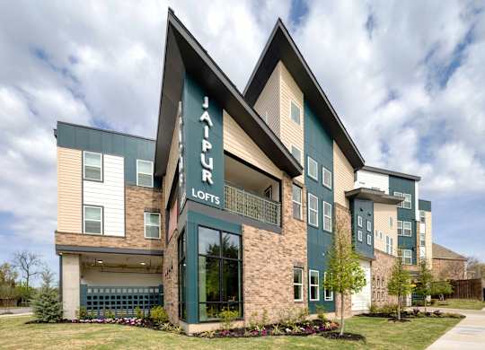A modern building with the name "JAPURK LOFTS" on the front.