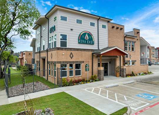 A building with a green sign that says Kivaleast on it.