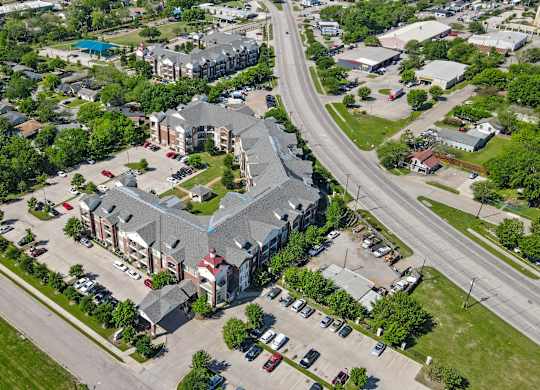 A large building with a parking lot in front of it.