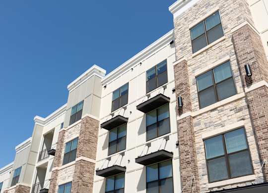 A modern building with a clear blue sky in the background.