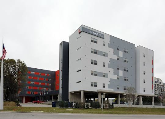 A large building with the word SUMMIT on the top.