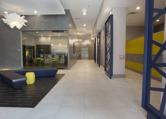A long hallway with a yellow ball on the floor.