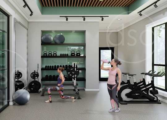 A woman is drinking water in a gym with a variety of equipment.