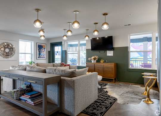 A living room with a grey sofa and a coffee table.