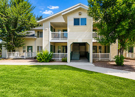 A white two-story apartment