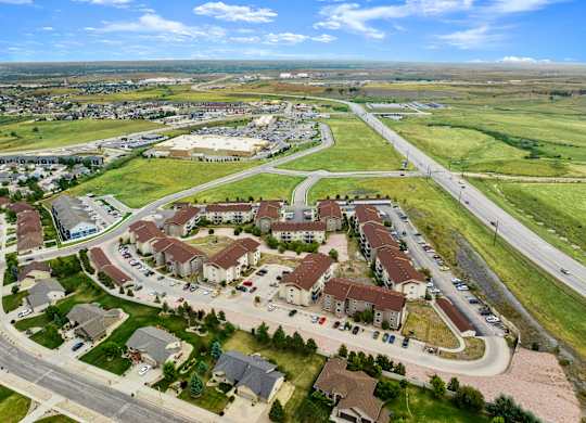 A bird's eye view of a residential area with houses and roads.