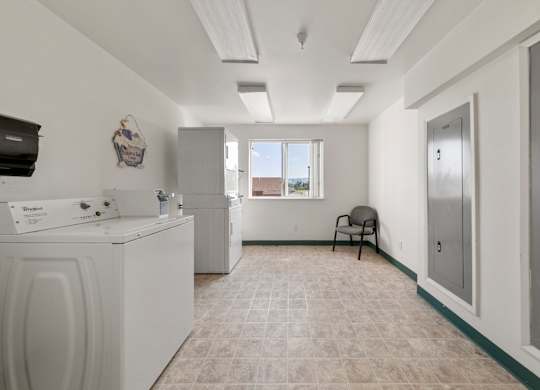 A laundry room with a washer and dryer.