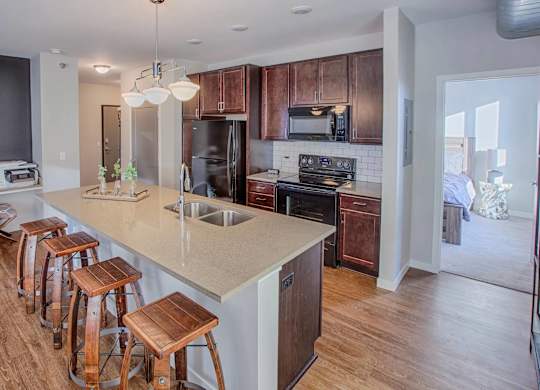 A kitchen with wooden cabinets and a white countertop.