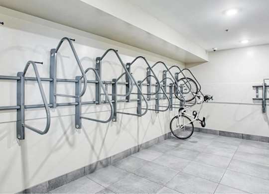 A bike is parked in a bike rack.