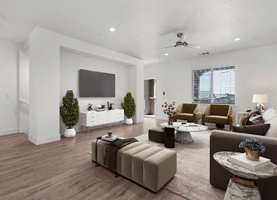 a living room with white walls and a tv on the wall