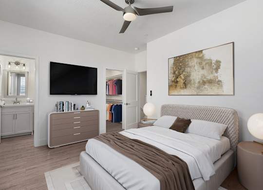 a bedroom with a bed and a ceiling fan