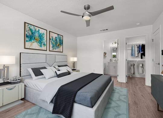 a bedroom with a bed and a ceiling fan
