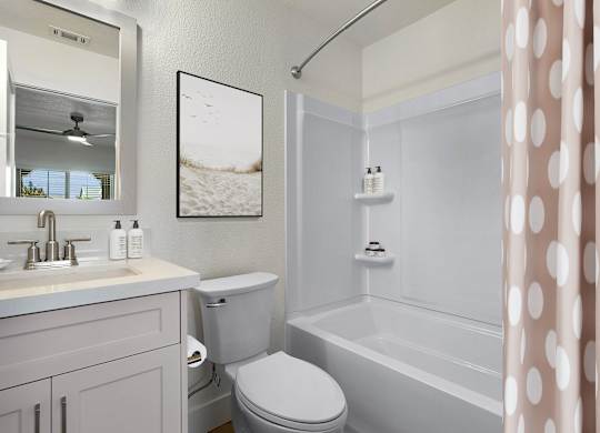 a white bathroom with a shower curtain and a toilet