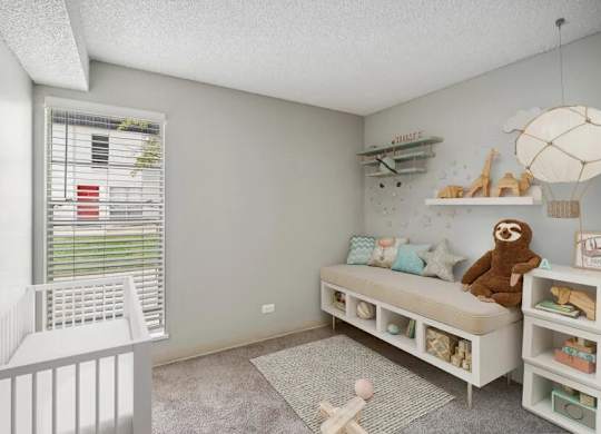 Baby's room with a crib at Villages at Gateway, Denver, CO