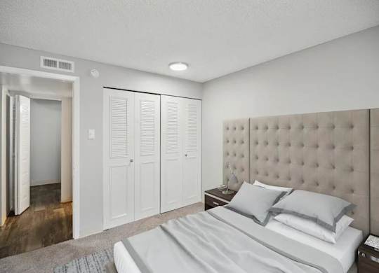 Bedroom with Large Bed at Villages at Gateway, Denver, CO