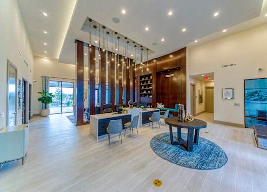 Modern clubhouse lobby with pendant lighting at Ciel Luxury Apartments, Jacksonville, Florida