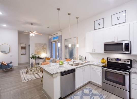 Open concept kitchen with granite countertops at Ciel Luxury Apartments, Jacksonville, FL