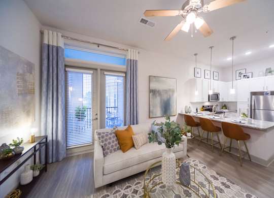 Open floor plan with kitchen island seating at Ciel Luxury Apartments, Jacksonville, Florida