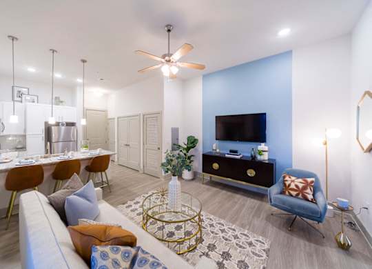Contemporary apartment living area with kitchen island at Ciel Luxury Apartments, Florida, 32246