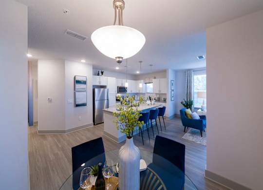 Open dining room with glass table at Ciel Luxury Apartments, Jacksonville, Florida