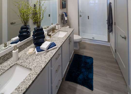 Spacious bathroom with dual vanity and walk in shower at Ciel Luxury Apartments, Jacksonville