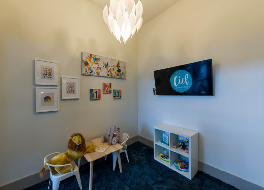 Childrens playroom with colorful wall art at Ciel Luxury Apartments, Jacksonville, FL