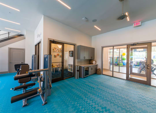 Fitness center with exercise machines and kitchenette at Ciel Luxury Apartments, Jacksonville, Florida