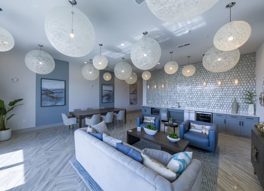 Community clubhouse with woven ceiling lights and blue accents at Ciel Luxury Apartments, Florida, 32246