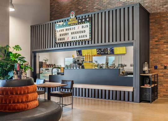 Coffee bar with live music signage at AMP 30 Apartments, San Diego, California