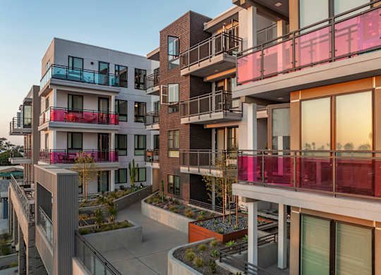Modern apartment complex with colorful balconies at AMP 30 Apartments, California, 92116
