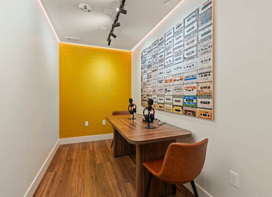 Podcast studio with vintage cassette tape wall art at AMP 30 Apartments, San Diego, 92116