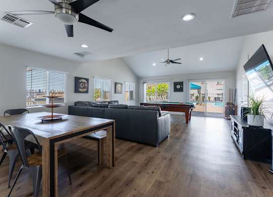 A modern living room with a dining table and a couch.