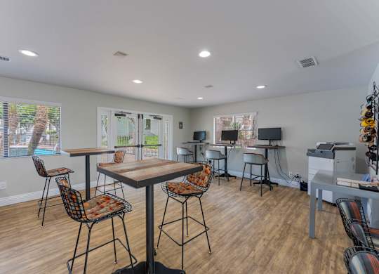 A dining area with a table and chairs is shown.