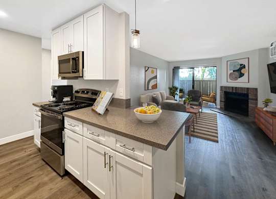 A kitchen with a countertop and cabinets.
