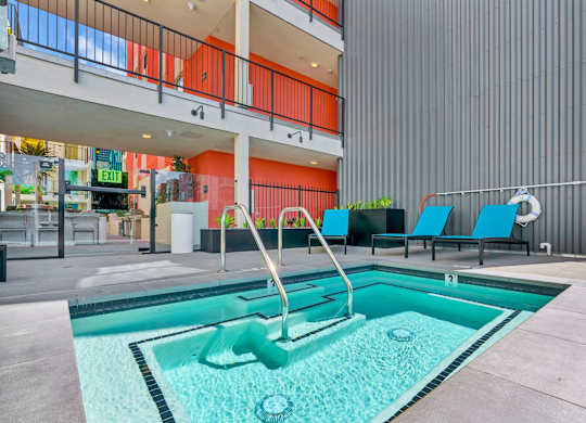 A pool with a slide in the middle of it.
