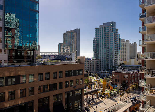 A cityscape with a mix of modern and older buildings.