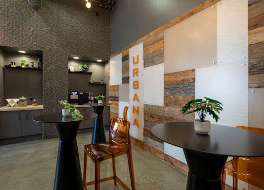 A room with a wooden wall and a sign that says
