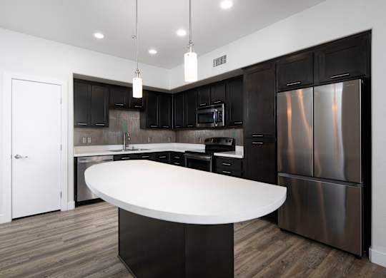 A modern kitchen with a large island in the middle.