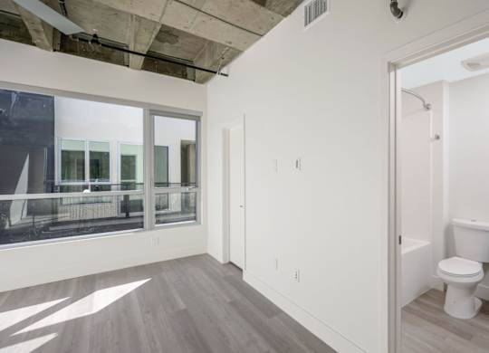 Living with open door to bathroom