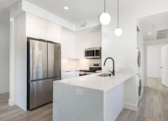White kitchen with pendants
