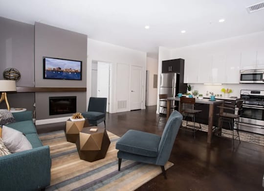 A modern living room with a fireplace and a television.