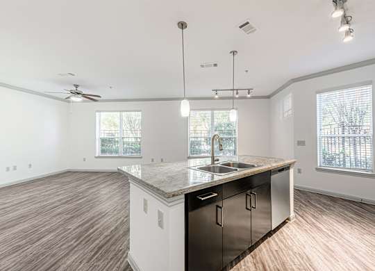 A kitchen with a sink and a countertop.