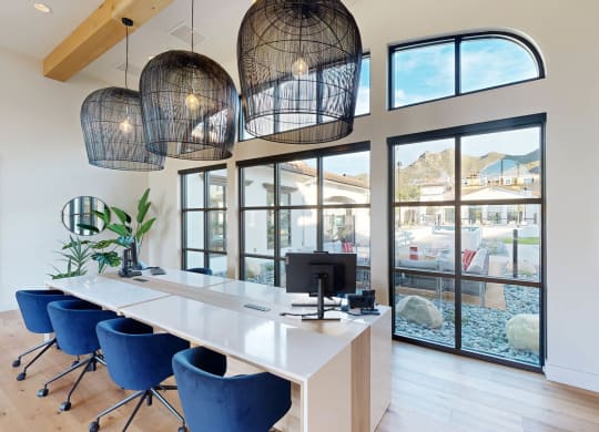 a conference room with a desk and chairs and large windows at The Villas at Anacapa Canyon, Camarillo, 93012