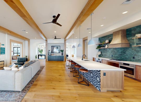 a large living room with a white couch and a kitchen at The Villas at Anacapa Canyon, California