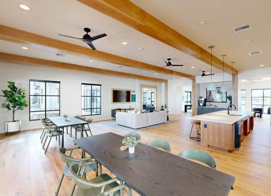 a large living room with a dining room table and a kitchen at The Villas at Anacapa Canyon, Camarillo, 93012