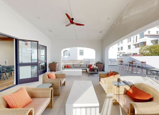 a living room with couches and chairs and a patio at The Villas at Anacapa Canyon, Camarillo, California