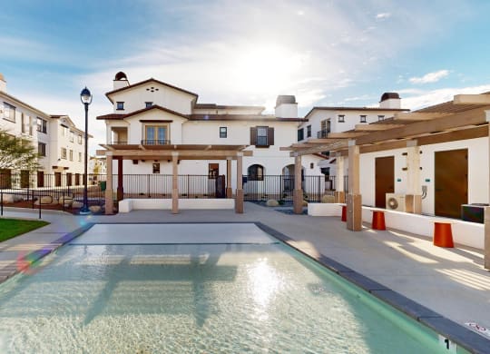 a view of a swimming pool in front of some apartments at The Villas at Anacapa Canyon, Camarillo, California