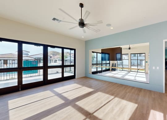 a large room with a pool and a ceiling fan at The Villas at Anacapa Canyon, Camarillo, California