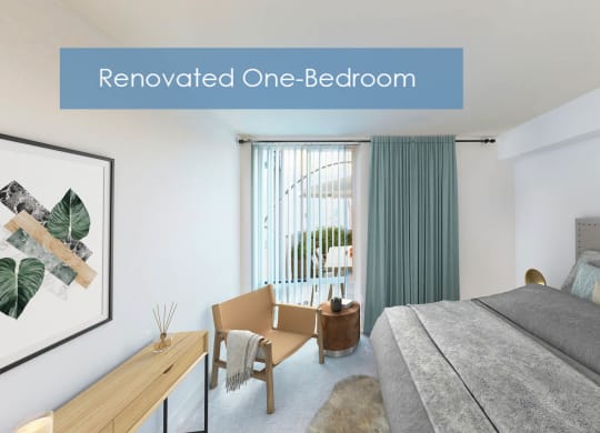 a bedroom with a bed and a desk and a window at The Meadows Apartments, Culver City