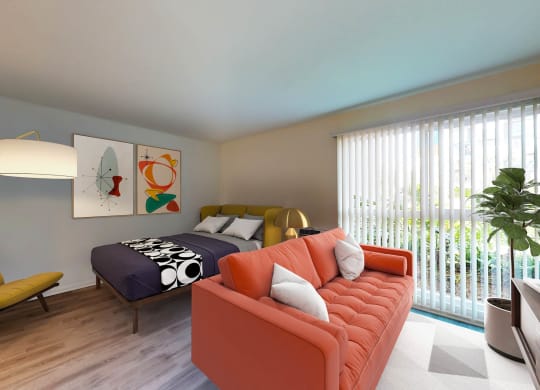 a bedroom with a bed and a couch in front of a window  at Rancho Los Feliz, California